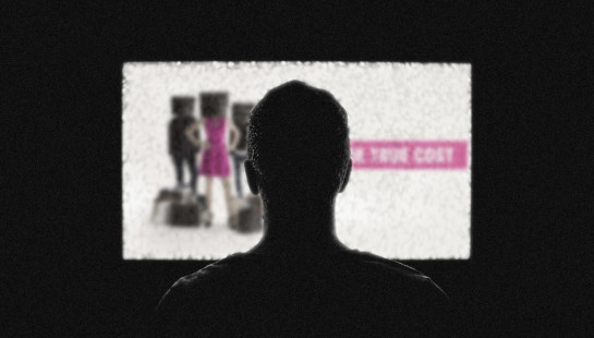 A silhouette of a man sits in front of a television screen featuring The True Cost documentary.
