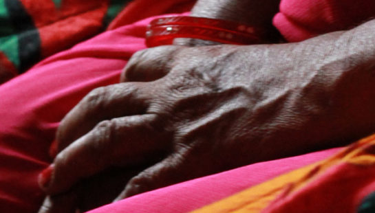 A close up shot of a woman's hands in her lap