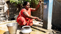 Woman washes her hands with clean water