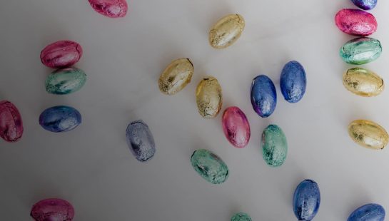 Easter eggs scattered on a white background