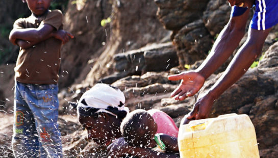 A family play in a river