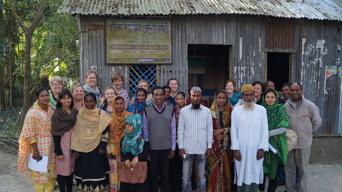 Steph Dobbin and other Baptist Women leaders stand in a group photo with community members of a Bangladesh village.