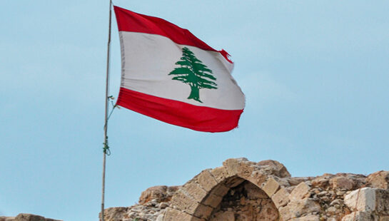 Lebanese flag on top of rock monument