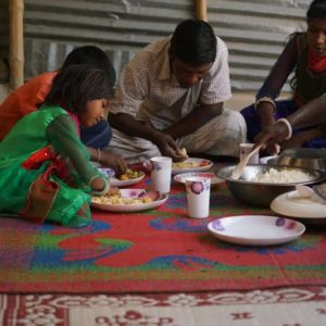 A family in Bangladesh eats a meal together
