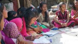 Children sit in a group