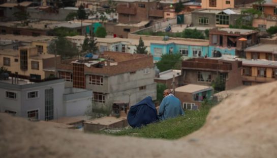 Image of couple sitting on a hill in Kabul, Afghanistan