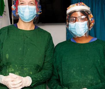 Two health care workers in their PPE