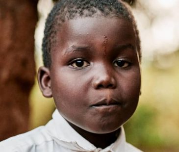 A young Ugandan boy in his school uniform