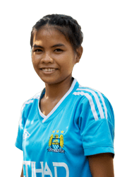 A young Cambodian girl in a sports jersey smiles
