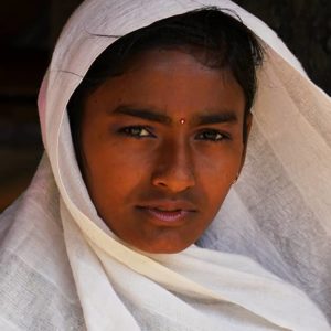 A girl in a white coloured head covering