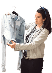 A woman holds a jean jacket
