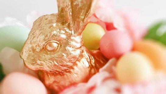 A chocolate bunny wrapped in gold foil