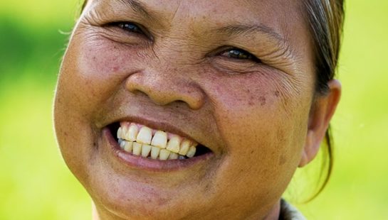 A Cambodian woman smiles brightly