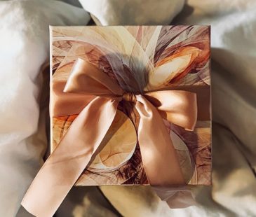A box wrapped in paper and a ribbon