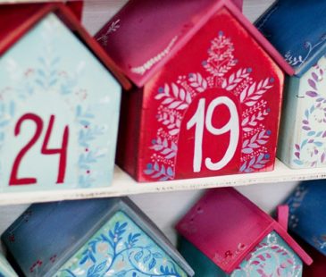 Colourful houses with the numbers counting down till Christmas