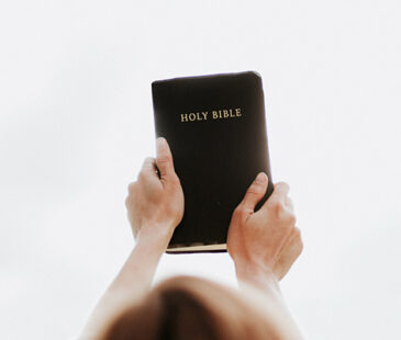 Woman's Hands Holding Bible