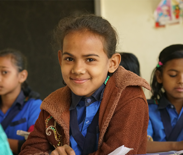 Girl Child smiling in the school classroom