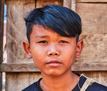 Young boy in Cambodia looking directly at the camera