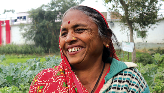 Matching Grant hero, Jagmati, smiling and looking right of camera